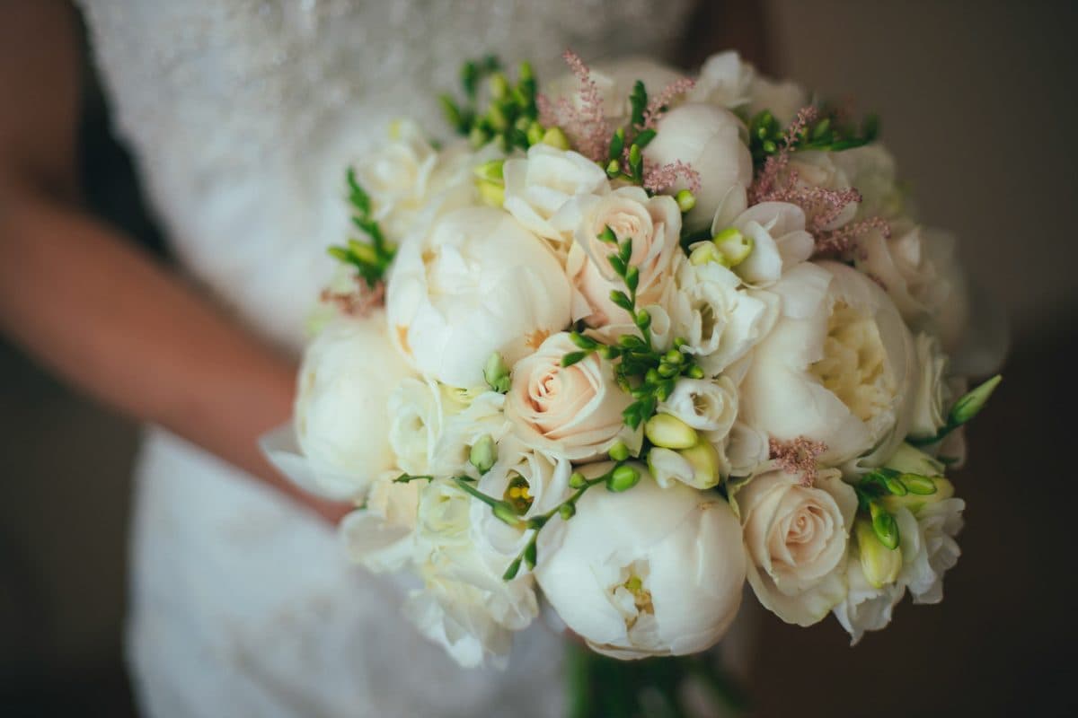 White peony and blush rose bridal bouquet, close-up