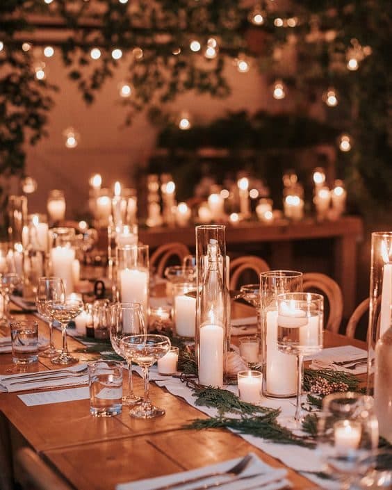 Candlelit wedding reception table with string lights